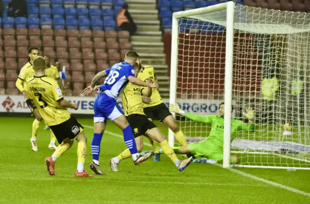 Burton Albion players celebrate a goal at Pirelli Stadium